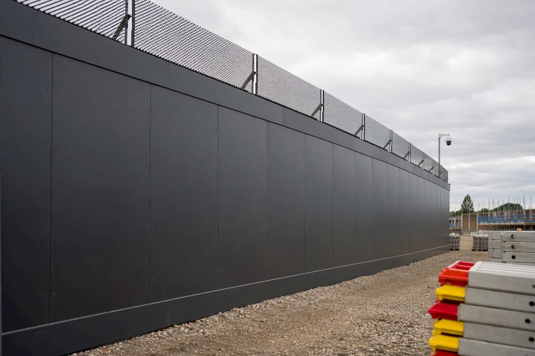 Monitored construction hoarding and anti climb fence
