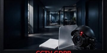 A security camera monitors an apartment entrance beside a privacy shield and GDPR document.